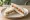 Cream Cheese and Smoked Salmon: an illustration of salmon, cream cheese, caper and dill on white bread.