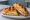 Croffle Sandwich (크로플 샌드위치): an illustration of ham, egg and cheese.