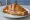 Croissant Jambon-Fromage: an illustration of ham, cheese and butter on croissant.