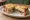 Croque-Forestier: an illustration of ham, mushroom, gruyère, béchamel and more on white bread.