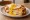 Croque-Madame: an illustration of ham, egg, gruyère, béchamel and more on white bread.