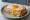 Croque-Madame Parisien: an illustration of ham, egg, gruyère, béchamel and more on white bread.