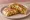 Crunchwrap Supreme: an illustration of beef, sour cream, lettuce and tomato on tortilla.