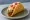 Crunchy Taco: an illustration of beef, cheddar cheese, lettuce, tomato and more on tortilla.