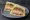 CU — Premium Deli Sandwich: an illustration of ham, egg, chicken, bacon and more on white bread.