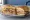 Cuban Sandwich (Key West): an illustration of ham, pork, swiss cheese, pickle and more on cuban bread.