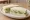 Cucumber and Mint: an illustration of butter, cucumber and mint on white bread.