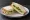 Cucumber Sandwich (Casual): an illustration of cucumber and butter on white bread.