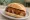 Currywurst mit Darm: an illustration of ketchup and curry powder on kaiser roll.