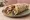 Dana Döner: an illustration of beef, onion, tomato, lettuce and more on pita.