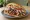 Döner mit allem: an illustration of beef, chicken, lettuce, cabbage and more.