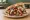 Döner scharf: an illustration of beef, chicken, lettuce, tomato and more.