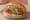 Döner Tombik: an illustration of beef, tomato, onion and lettuce.