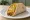 Double Decker Taco: an illustration of beef, beans, cheddar cheese, lettuce and more on tortilla.