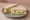 Egg and Anchovy: an illustration of egg, anchovy, mayonnaise and butter on white bread.