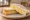 Egg and Cheese: an illustration of egg, cheese and butter on white bread.