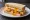 Egg and Chips Sandwich: an illustration of egg and butter on white bread.
