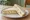Egg and Chive: an illustration of egg, mayonnaise, scallion and butter on white bread.