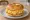 Egg Bagel Sandwich: an illustration of egg, american cheese, butter and pepper on bagel.