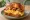 Egg Drop — Bacon Cheese: an illustration of egg, bacon, cheddar cheese and mayonnaise on brioche.