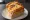 Egg Drop Sandwich (에그드랍): an illustration of egg, bacon, ham, cheese and more on brioche.