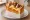 Egg Drop — Teriyaki BBQ: an illustration of chicken, pork, egg, cheese and more on brioche.