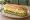 Egg Salad Grinder: an illustration of egg and mayonnaise on hoagie roll.