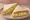 Egg Salad Sandwich: an illustration of egg, mayonnaise, mustard, celery and more on white bread.