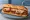 Eggplant Grinder: an illustration of eggplant, marinara and mozzarella on hoagie roll.