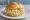 Eiersalat Brötchen: an illustration of egg, mayonnaise, mustard and scallion on bread.