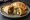 Empanada: an illustration of beef, onion, egg and olives.
