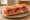 Entrepà de Pernil: an illustration of ham, tomato and olive oil on baguette.