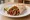 Fajita (in Tortilla): an illustration of beef, pepper, onion and lime on tortilla.