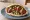 Falafel Adom (פלאפל אדום): an illustration of chickpeas, pepper, tahini, parsley and more on pita.