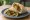 Falafel ma' Hummus (فلافل مع حمص): an illustration of chickpeas, hummus, tahini, parsley and more on pita.