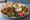 Falafel Plate (صحن فلافل): an illustration of chickpeas, hummus, tahini, parsley and more on pita.