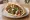 Falafel Yarok (פלאפל ירוק): an illustration of chickpeas, parsley, cilantro, tahini and more on pita.