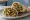 Fattoush Sandwich: an illustration of cucumber, tomato, radish, lettuce and more on pita.