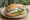 Fischbrötchen: an illustration of herring, onion, pickle and remoulade on bread.