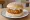 Fish Cake Sandwich: an illustration of fish, potato and tartar sauce on white bread.