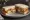 Fish Finger and Cheese: an illustration of fish, cheddar cheese and ketchup on white bread.