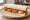 Fish Finger Butty: an illustration of fish and butter on white bread.