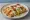 Flauta de Pollo: an illustration of chicken on tortilla.