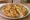 Focaccia con le Cipolle: an illustration of onion and olive oil.