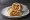 Frankie: an illustration of egg, onion, chutney and vinegar on naan.