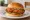 Fried Chicken Sandwich: an illustration of chicken, pickle and mayonnaise on burger bun.