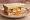 Fried Egg Butty: an illustration of egg and butter on white bread.