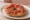 Frisella con Pomodoro: an illustration of tomato, olive oil and oregano.