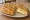 Fugazzeta Rellena: an illustration of onion, mozzarella and oregano.