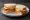 Gammon and Egg: an illustration of egg and butter on white bread.